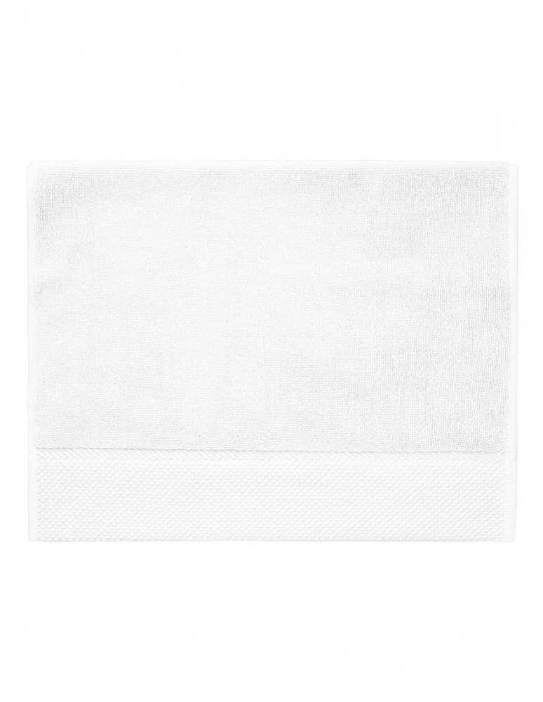 Serviette invité personnalisée coloris blanc : gros plan sur la matière, 100 % coton peigné zero-twist (modèle Beaubourg)